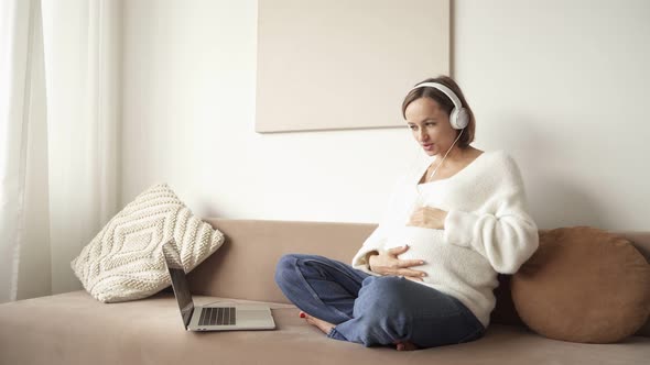 Pregnant Woman Having Video Call. Online Consultation