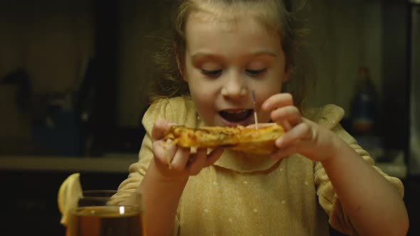 Cheerful Little Girl Tastes New York Pizza