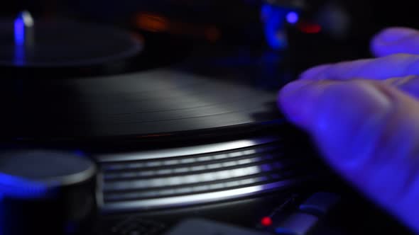 DJ Scratching Vinyl Record on Professional Gramophone Disco Party in 1980's