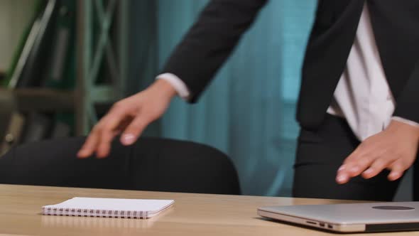 Portrait of African American Woman Sits Down at the Table Opens the Laptop and Starts Work