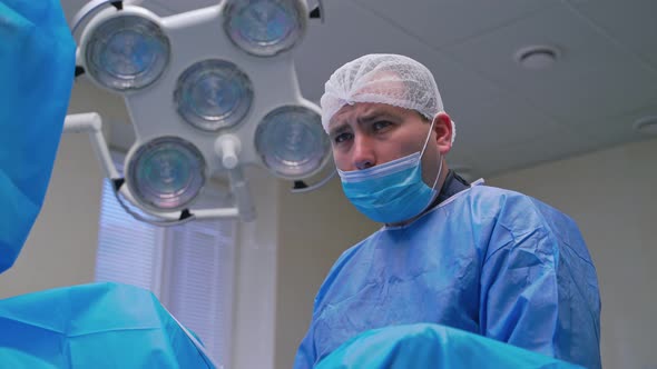 Portrait of a Surgeon in Mask at Work