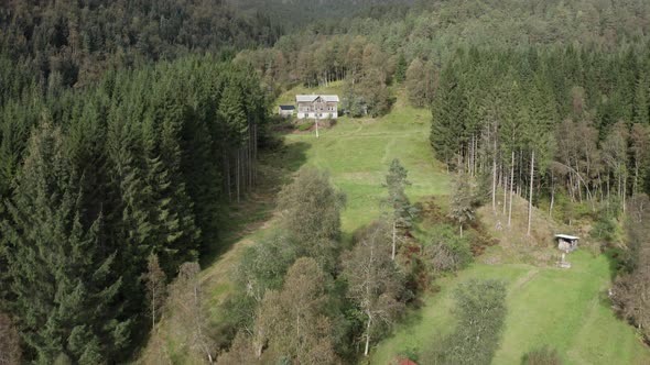 Aerial shot getting Close to abandoned farm Surrounded by Nature - Norway