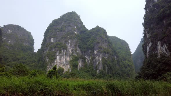 Tam Coc landscape of limestone karst mountains on Ninh Binh province Vietnam seen from a boat on the