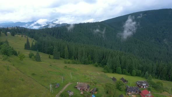 Evening Mountain Village Covered With The Clouds