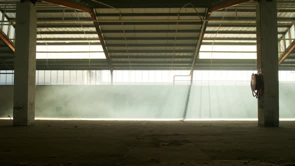 An empty warehouse with smoke grenade