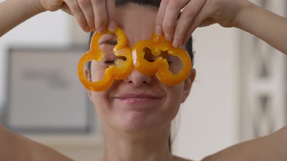 Front View Headshot Charming Cheerful Vegan Woman Having Fun Playing with Bell Pepper