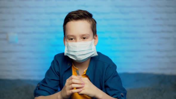 boy wearing medical mask protection coronavirus COVID-19 or dust pm2.5 thumbs up safety healthy self