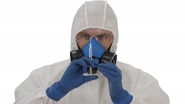 Scientist in Protective Gear Holding Syringe with Injection on White Background