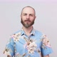 Portrait of calm bearded man looking at camera wearing hawaiian shirt - VideoHive Item for Sale