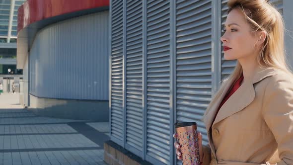 Blond Holds Thermo Mug