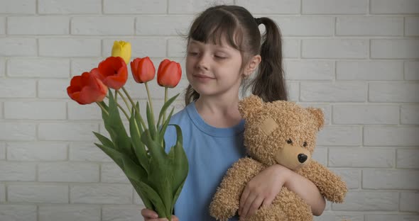 Little Girl Gives Flowers