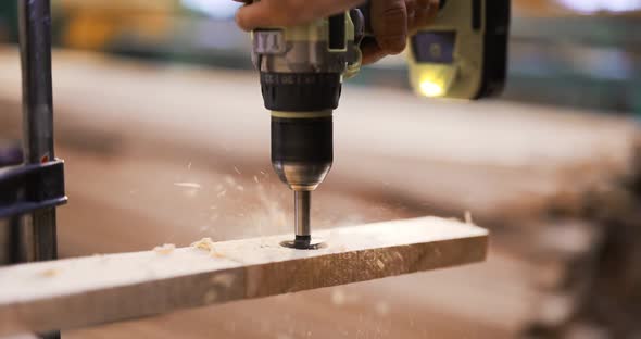 Drilling a Hole in Wooden Plank