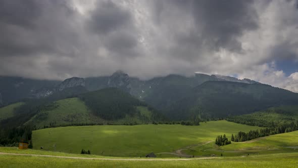 Moving clouds over Bielskie Tatra mountains in summer, Slovakia, timelapse, 4K