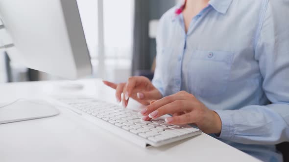 Female Hands Typing on a Computer Keyboard