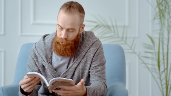 Portrait of a Man with a Red Beard Reading a Book