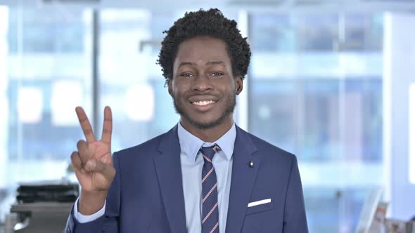 Successful African American Businessman Showing Victory Sign
