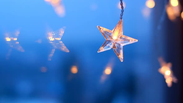 Star garland.Christmas and New Years time. Shining star on blue background