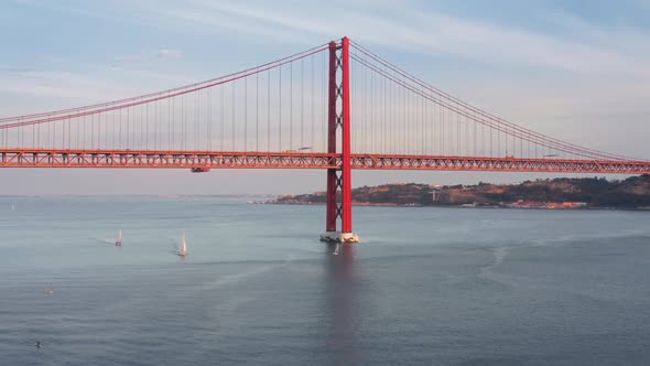 Drone Footage of Red Suspension Bridge with Decks and Guardrails