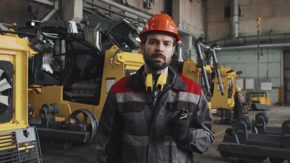 Workman Posing at Plant