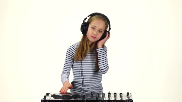 Girl with Headphones on Head Dancing To Music. Slow Motion