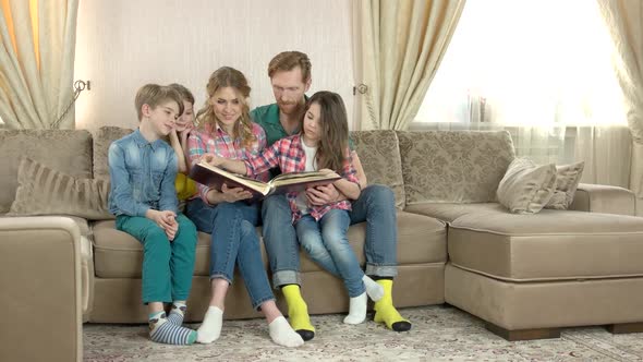 Family Looking at Photo Album