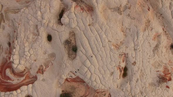 Aerial view of desert landscape with person walking