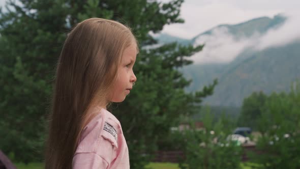 Tranquil Little Girl with Loose Hair at Highland Resort