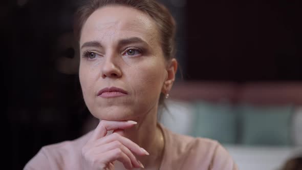 Closeup Portrait Thoughtful Middleaged Caucasian Woman Sitting Indoors Thinking