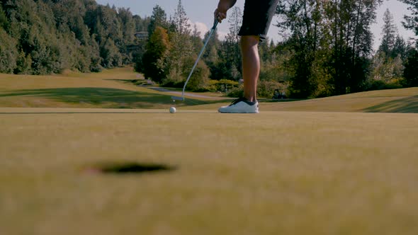 Golfer Makes A Putt On The Green