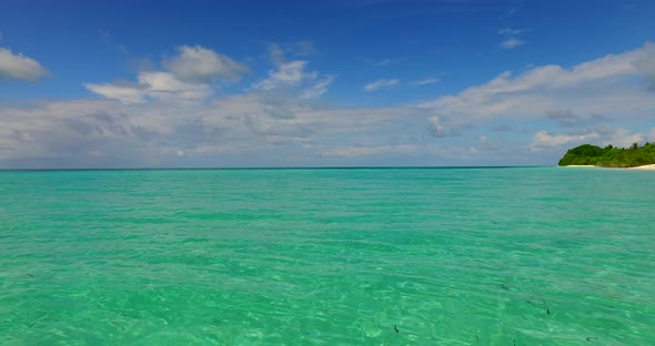 Beautiful above island view of a sunshine white sandy paradise beach and aqua blue ocean background 