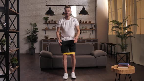 Smiling Fit Man Exercising at Home During Lockdown