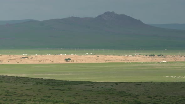 Desert Sand Dunes and Ger Yurts in Mongolian Meadows