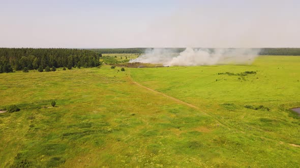 Epic Bird'seye View Fire in the Field Dry Grass Burning
