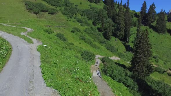 Aerial view of mountain bikers on a scenic singletrack trail
