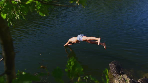 Man jumping in a lake