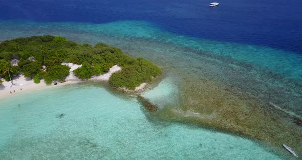 Beautiful flying copy space shot of a white paradise beach and turquoise sea background in colourful