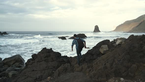 Young Man Tourist Walking on the Famous Volcanic Black Sand Beach Benijo in the North of Canary