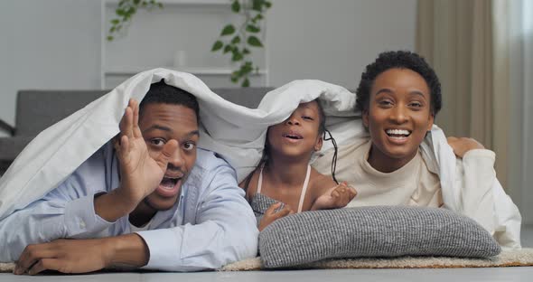 Afro American Family Hiding Under Warm White Blanket Appears Waving Hands Hello Shouting Noisy Smile