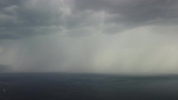 Aerial View Footage of Rain Clouds Over Sea Ocean Black Clouds in Bad Weather Day Over Sea Surface