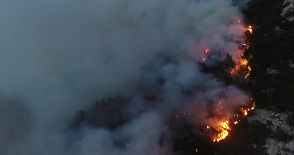 Aerial Panoramic View of a Forest Fire at Night Heavy Smoke Causes Air Pollution and Fire in Full