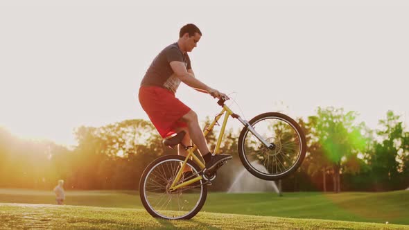 Biker Stunt Performer Effectively Performs Stunts on a Bicycle