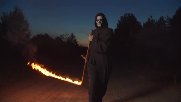 Creepy Grim Reaper Mowing with Burning Scythe