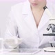 Microbiologist Works with Microscope Records Clinically Proven Results on Tablet - VideoHive Item for Sale