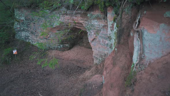 Ziedleju Reddish Sandstones Cliffs Outcrop and Cave in Latvia, Europe