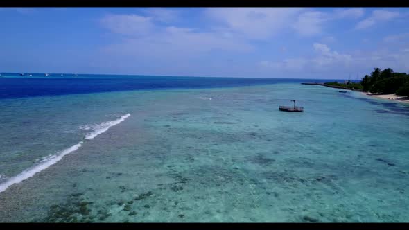 Aerial drone view scenery of marine lagoon beach break by blue water and white sand background of a 