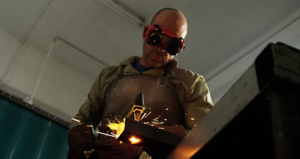 Welder welding a metal