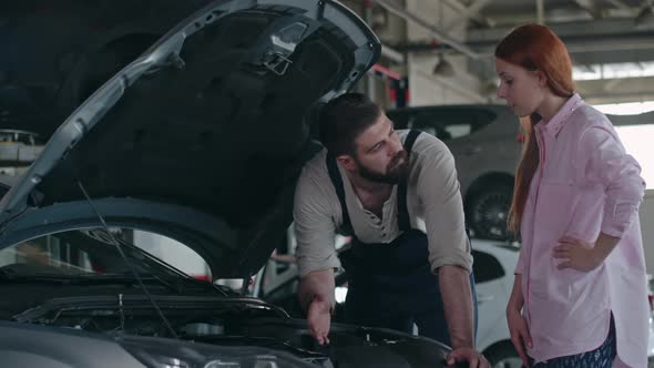 Maintenance Worker Checking Car alt