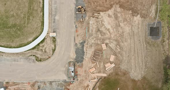 Aerial View on the New Apartment Building in Construction Material Construction Site