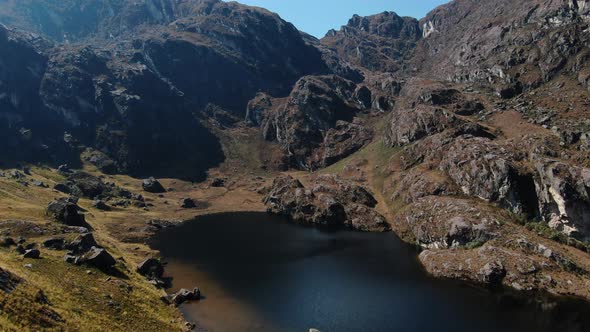 4k aerial drone footage over the 5th lagoon of Pichgacocha from Ambo, Huanuco, Peru in the Andes mou