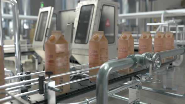 Factory Manufacturing Light Cream Packs On Automatic Distribution Equipment